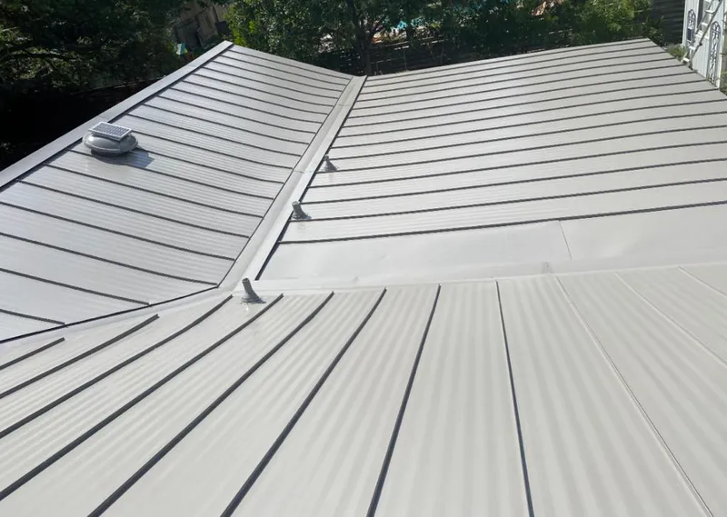 Solar attic fan installed on a metal roof for Roof Ventilation in Nappanee